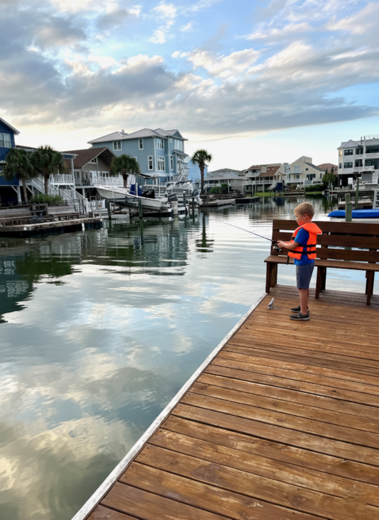 fishing on dock at waterfront rental in Ocean Isle, North Carolina